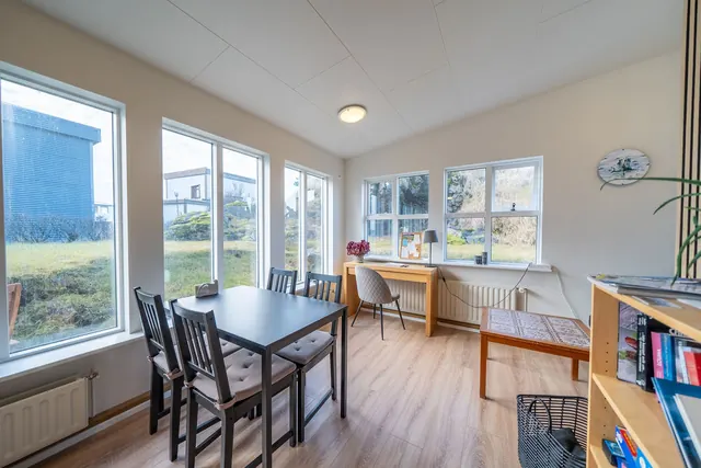 The shared dining room, with windows along one side