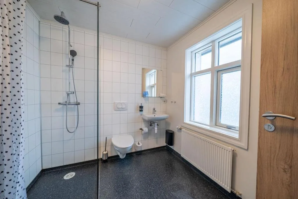 Private bathroom with a glass shower screen