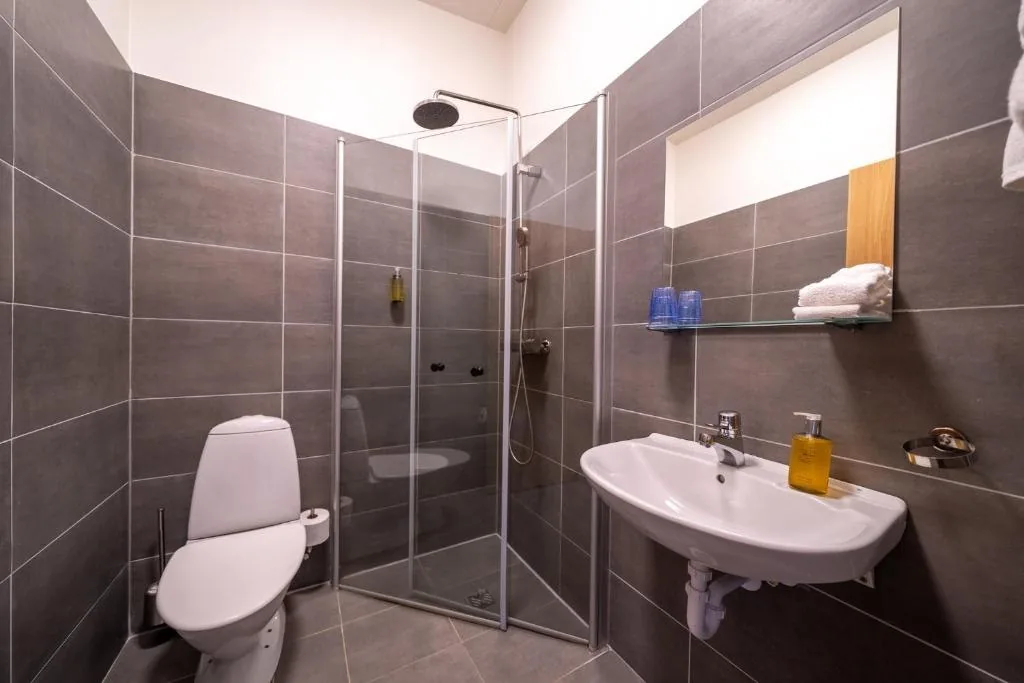 Tiled bathroom with a walk-in shower